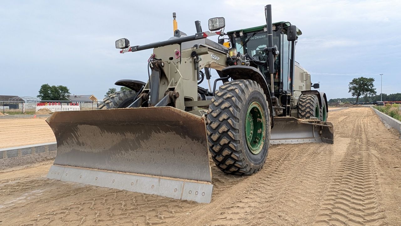 Powerful construction machine operating on a road site in Werlte, Germany.